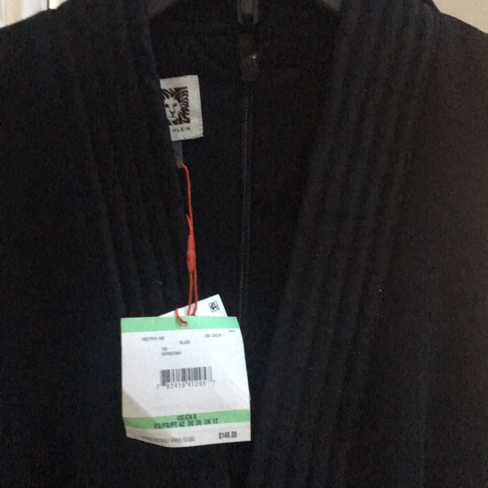 Brand new Anne Klein black crepe dress.
